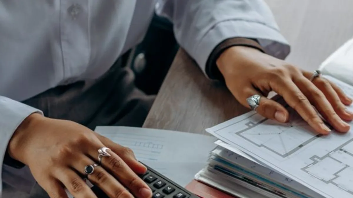 Bookkeeping documents and a calculator on a working desk