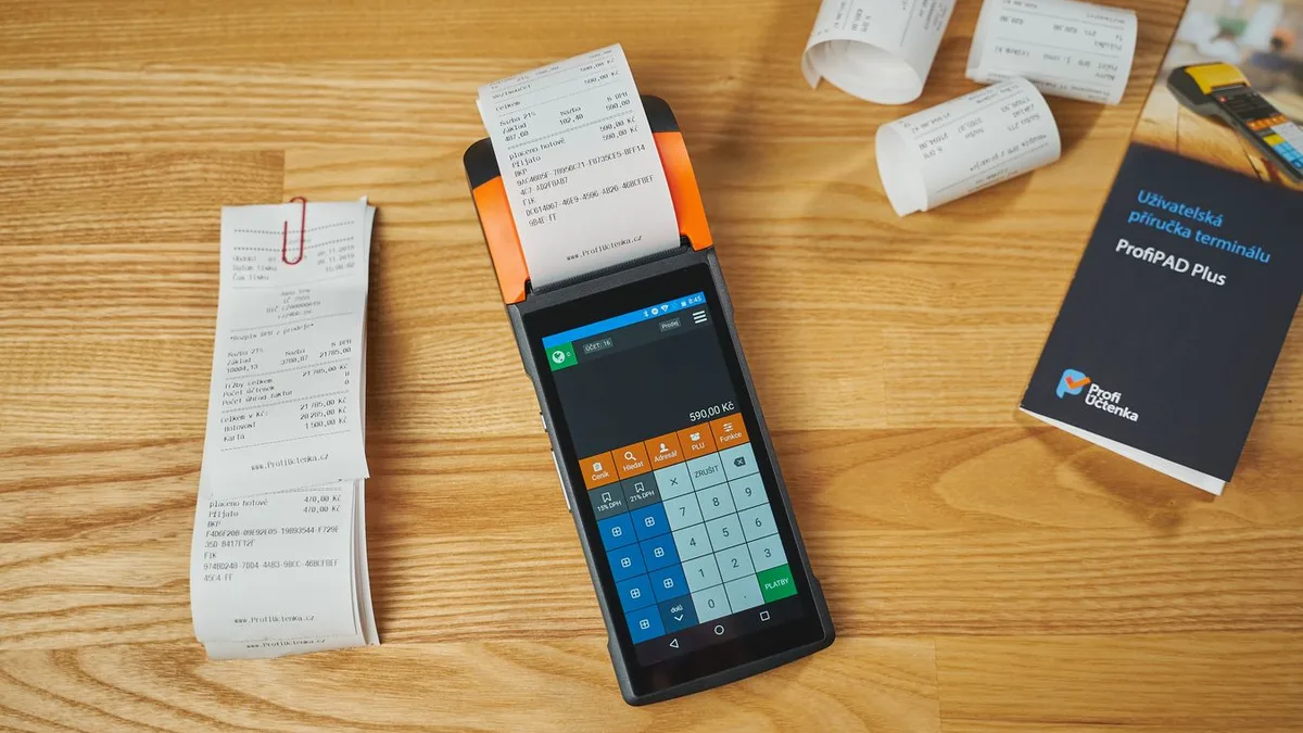 Payment terminal and receipts arranged on a desk