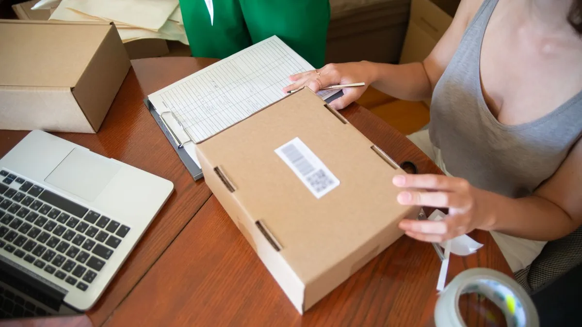 E-commerce operator preparing customer orders for shipment