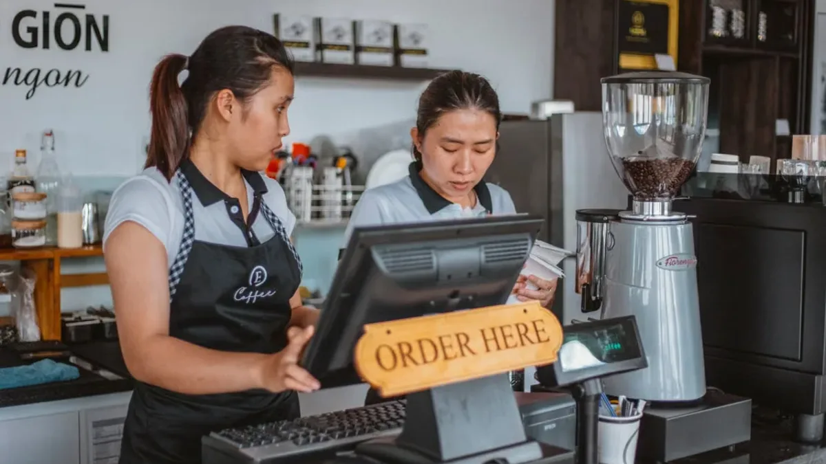 Hospitality team working at a point-of-sale counter